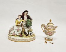 Dresden porcelain group of two rustic figures with bird in cage, oval base, 16cm high and a