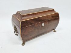 19th century mahogany sarcophagus-shaped tea caddy with inlaid decoration, the lid opening to reveal