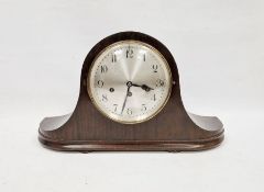 Early 20th century mahogany-cased Napoleon-hat shaped mantel clock, the circular silver dial with