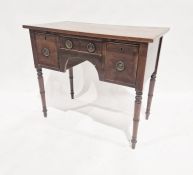 19th century mahogany kneehole dressing chest with three drawers arranged around the kneehole,