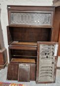 A mahogany Globe Wernicke style bookcase unit comprising three leaded glass glazed units over a