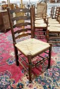 Set of 10 early 20th century oak ladderback rush seated dining chairs comprising eight standards and