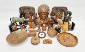 Carved wooden Native American mask wearing feathered headdress and quantity other wooden and