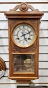 Contemporary wall clock by W Watts & Son, the circular dial with Roman numerals denoting hours,