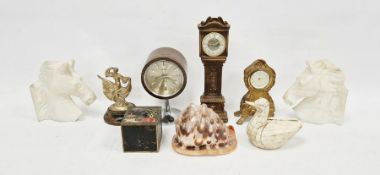 Vintage clock, circular on an aluminium pedestal, veneered, named 'Coral' 20 cms high, a conch