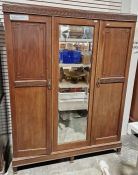 Early 20th century mahogany two-section wardrobe with two doors having carved geometric