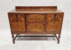 20th century burr walnut sideboard with pair of drawers flanked by pair of cupoboards, on turned