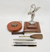 'Spirit of Ecstasy' car mascot mounted on a wooden base, two stainless steel Parker pen biros, two