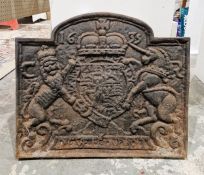 Antique iron fireback with broken arched top, having crowned crest and date 1635, 51cm high x 59cm