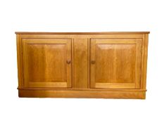 Modern lightwood, possibly maple, sideboard having moulded edge, two cupboards enclosed by framed