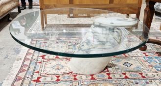 Contemporary glass-topped coffee table of oval form, raised on large single piece of cylindrical