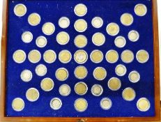 Presentation case of brass and silver 3d in a purpose built case, case opens to access coins,