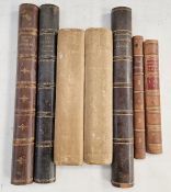 A box of book spines that have been stuck onto wood - we imagine to create a faux bookshelf/door -