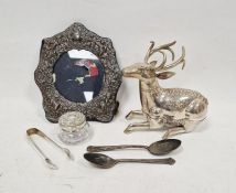 Silver coloured metal deer with engraved decoration, Arabic writing to base, 15cm high, a 1980s