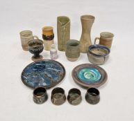 Quantity of studio pottery to include candle holder, various mugs, vases, many marked to base,