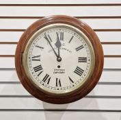 Mahogany cased wall clock, the circular dial with Roman numerals denoting hours, dial marked M.R.C