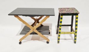 Grey painted and lightwood two-tier trolley, rectangular, on castors, a  painted sign that reads 