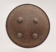 Indian metal dhal/shield with etched scrolled decoration and four bosses, 26cm diameter approx.