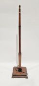 20th century oak standard lamp, square section, tapered, on square base, 146cm high approx.