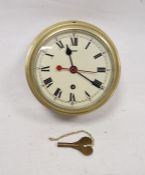 Brass cased bulkhead ships clock by Elliott Ltd of London, the circular dial with Roman numerals