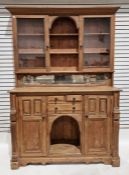 Large distressed pine dresser, the raised back with central arch over two shelves, flanked by pair