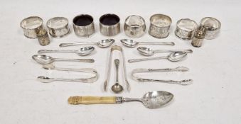 Assorted silver napkin rings, teaspoons, sugar nips, etc
