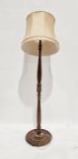Wooden turned standard lamp with cream shade, 188cm high approx. (including shade)