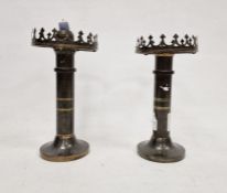 Two bronze-effect and gilt Arts & Crafts-style candlesticks (weighted) (2)