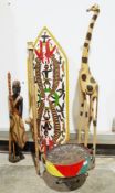 African carved model of a giraffe, a steelpan drum, a pair of women's Geta shoes, a wooden shield