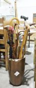 Collection of walking sticks and other items  in ceramic stick stand