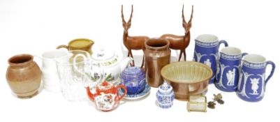 Three Wedgwood Jasperware-style blue jugs, a vintage stoneware jelly mould, two carved wooden models