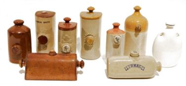 Quantity of stoneware hot water bottles to include examples by Mence Smith, Grimwades, J. R. Price