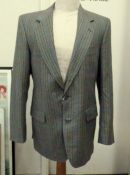 A vintage tweed suit, labelled Cecil G., a three piece black suit to include waistcoat, Hardy