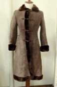 A vintage sheepskin coat with frog fastening and fur collar cuffs and hemCondition ReportFew small