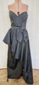 David Emanuel black moire silk cocktail dress, bow detail and half peplum to the front waist with