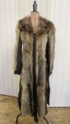 A vintage racoon and suede fur coat, quilted lining, suede tie belt, labelled TurkistukkOy, made