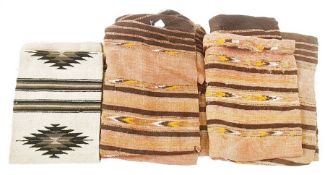 Two woven wool panels/hangings with geometric stripes, in shades of madder red, yellow, black, white