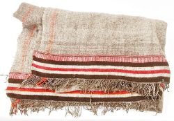 Brown, pink and cream woven wool tasselled rug, two panels stitched together, with striped border,