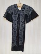 A black velvet Victorian lappet detail removed from a full cape or coat, applied lace detail and
