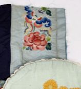 Black silk remnant of Chinese embroidery with a butterfly and a peony on turquoise ground, a Chinese