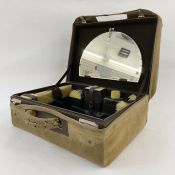 Vintage travelling dressing set with enamel lids, containing an atomiser, three glass enamel