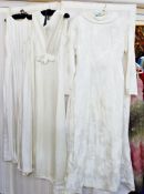 A1960's figured satin wedding dress, fitted bodice, full length sleeves, full skirt and train, a