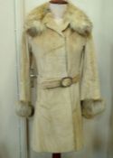 A vintage Fendi fur coat made in Italy, the lining with various zipped pockets, internal waist