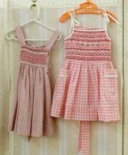 Various hand smocked pinafores and dresses by Daisy Chain, ages 2 and 3, Liberty print and other