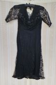 A 1920's/30's black crepe dress, lace godets, lace sleeves, beaded bodice in faux jet, and a black