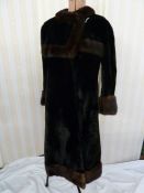 A black moleskin and mink vintage coat, labelled Neustadter, the square fold over collar, the
