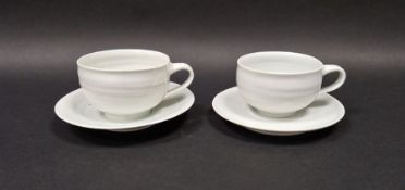 Joanna Howells (b.1960) a pair of studio porcelain cups and saucers with celadon glaze, impressed JH