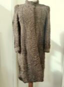 A Persian lamb full length brown coat, collarless, lining has been replaced with a jazzy