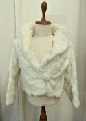 A short white coney jacket with bobble and hook fastening, cashier's name tape in lining, full