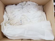 A silk lace and embroidered small blouse, back button fastening, blue ribbon threaded through,